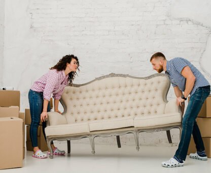 Couple moving sofa